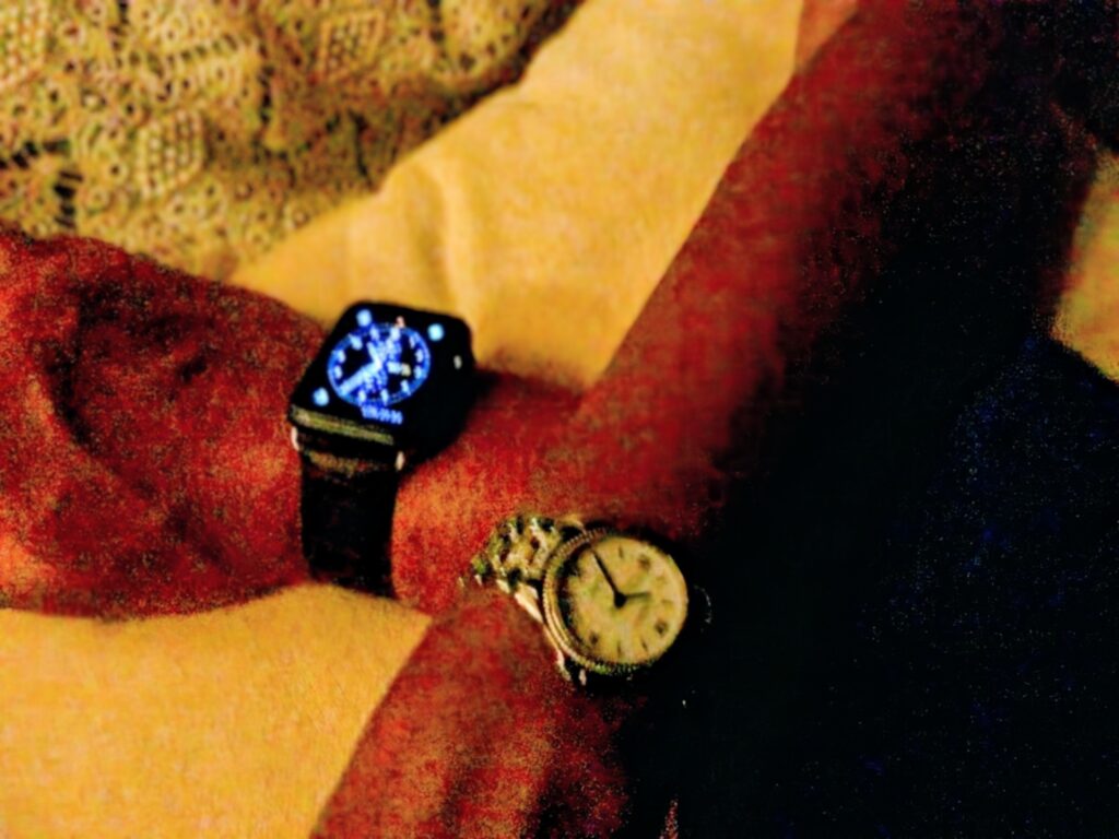 Watches on Wrists, one analogue watch and one smart watch. Used to represent the passing of time
