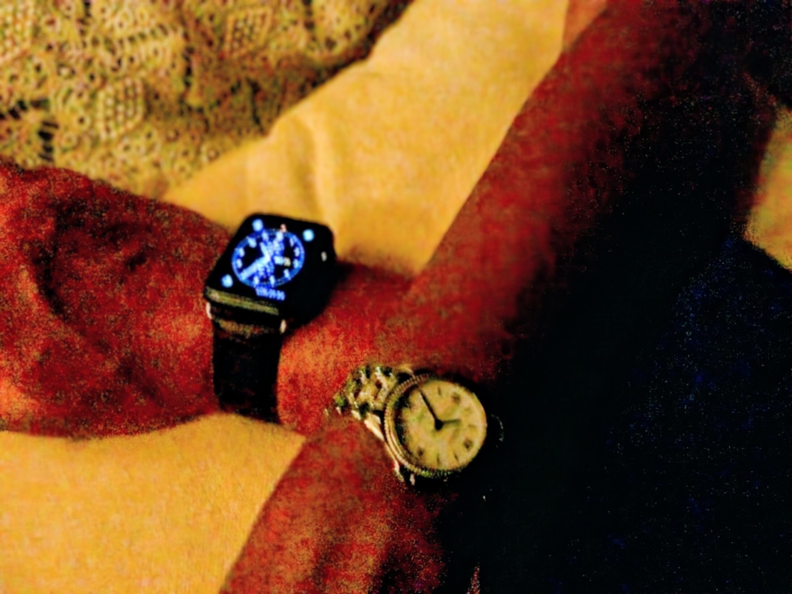 Watches on Wrists, one analogue watch and one smart watch. Used to represent the passing of time